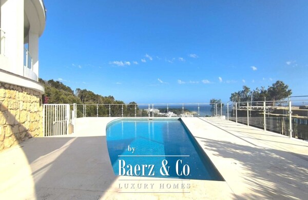 photo 1 EXCLUSIVE MEDITERRANEAN VILLA WITH HEATED SWIMMING POOL, TOURIST LICENCE AND SPECTACULAR SEA VIEWS IN SANTO TOMÁS, MENORCA